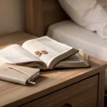 Open Bible beside wedding rings representing biblical teaching about marital intimacy